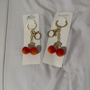 NWT bundle of 2,Cherry Charm Keychain. Red and Gold